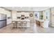 Open kitchen boasts an island with seating and white cabinetry at 6732 Broad River Ave, Land O Lakes, FL 34638