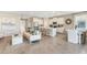 Open floor plan with kitchen island and dining area at 6732 Broad River Ave, Land O Lakes, FL 34638