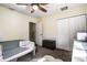 Bright bedroom with ceiling fan, carpet flooring, and built in shelving at 720 Sunset Dr, Tarpon Springs, FL 34689