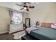 Bedroom with queen bed, ceiling fan, and built-in dresser at 720 Sunset Dr, Tarpon Springs, FL 34689