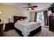 Bedroom with queen bed, ceiling fan, and ample closet space at 720 Sunset Dr, Tarpon Springs, FL 34689