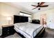 Main bedroom with king bed, ceiling fan and ensuite access at 720 Sunset Dr, Tarpon Springs, FL 34689