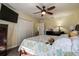 Bedroom with queen bed, ceiling fan, and double door closet at 720 Sunset Dr, Tarpon Springs, FL 34689