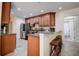 Modern kitchen with granite counters, island and breakfast bar at 720 Sunset Dr, Tarpon Springs, FL 34689