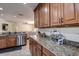 Kitchen with granite countertops and ample wood cabinets at 720 Sunset Dr, Tarpon Springs, FL 34689