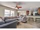 Open living room and kitchen with a large sectional sofa at 720 Sunset Dr, Tarpon Springs, FL 34689