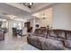 Spacious living room with a large sectional sofa and view into the dining area at 720 Sunset Dr, Tarpon Springs, FL 34689