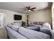 Spacious living room with sectional sofa and large TV at 720 Sunset Dr, Tarpon Springs, FL 34689