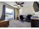 Home office features built-in desk, two chairs, and a view of the backyard pool at 720 Sunset Dr, Tarpon Springs, FL 34689