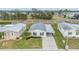 Mobile home with covered carport and surrounding homes at 7800 Kay Marie Ave, Zephyrhills, FL 33541