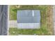 Aerial view of a single-wide mobile home with a gray metal roof at 7800 Kay Marie Ave, Zephyrhills, FL 33541