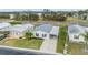 Aerial view of a mobile home community, showcasing a single-wide home with a gray metal roof and carport at 7800 Kay Marie Ave, Zephyrhills, FL 33541