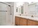 Bathroom with double vanity and a large walk-in shower at 7800 Kay Marie Ave, Zephyrhills, FL 33541