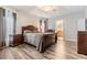 Spacious bedroom with wood-look floors and a large bed at 7800 Kay Marie Ave, Zephyrhills, FL 33541