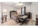 Guest bedroom with wood-look floors and a queen-size bed at 7800 Kay Marie Ave, Zephyrhills, FL 33541