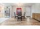 Cozy dining area with glass table and four chairs at 7800 Kay Marie Ave, Zephyrhills, FL 33541