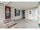 Covered entryway with steps leading to the front door at 7800 Kay Marie Ave, Zephyrhills, FL 33541