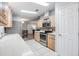 Modern kitchen with stainless steel appliances and light wood cabinets at 7800 Kay Marie Ave, Zephyrhills, FL 33541
