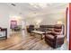 Spacious living room with hardwood floors and comfy seating at 7800 Kay Marie Ave, Zephyrhills, FL 33541