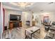Open living room and kitchen with laminate flooring at 7800 Kay Marie Ave, Zephyrhills, FL 33541