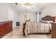 Main bedroom with wood furniture and wood-look floors at 7800 Kay Marie Ave, Zephyrhills, FL 33541