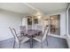 Screened porch with table and chairs at 7800 Kay Marie Ave, Zephyrhills, FL 33541