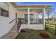 Steps lead to a backyard patio with built-in grill and fenced yard at 9050 San Martin Ne Blvd, St Petersburg, FL 33702