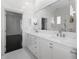 Bright bathroom with double vanity and marble floors at 9050 San Martin Ne Blvd, St Petersburg, FL 33702
