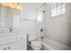 Elegant bathroom with marble tile and modern fixtures at 9050 San Martin Ne Blvd, St Petersburg, FL 33702