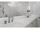 Bathroom vanity with marble countertop and chrome fixtures at 9050 San Martin Ne Blvd, St Petersburg, FL 33702