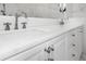 White bathroom vanity with marble countertop and sleek hardware at 9050 San Martin Ne Blvd, St Petersburg, FL 33702