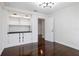 Bedroom with built-in shelving and hardwood floors at 9050 San Martin Ne Blvd, St Petersburg, FL 33702