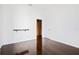 Bright bedroom with hardwood floors and en-suite bathroom access at 9050 San Martin Ne Blvd, St Petersburg, FL 33702
