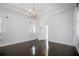 Bright bedroom features hardwood floors, chandelier, and walk-in closet at 9050 San Martin Ne Blvd, St Petersburg, FL 33702
