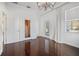 Bright bedroom with hardwood floors, large window, and private balcony at 9050 San Martin Ne Blvd, St Petersburg, FL 33702