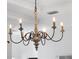Ornate chandelier with six candle-style lights at 9050 San Martin Ne Blvd, St Petersburg, FL 33702