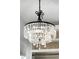 Elegant crystal chandelier illuminates a room at 9050 San Martin Ne Blvd, St Petersburg, FL 33702