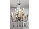 Rustic-chic chandelier with wooden beads and candle-style lights at 9050 San Martin Ne Blvd, St Petersburg, FL 33702