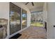 Outdoor patio with kitchen access, paver floor, and tranquil backyard view at 9050 San Martin Ne Blvd, St Petersburg, FL 33702