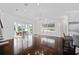 Open concept dining area with hardwood floors and access to a patio at 9050 San Martin Ne Blvd, St Petersburg, FL 33702