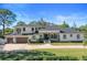 Luxury two-story home with a three-car garage and landscaped yard at 9050 San Martin Ne Blvd, St Petersburg, FL 33702