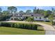 Luxury home with a circular driveway and beautifully landscaped grounds at 9050 San Martin Ne Blvd, St Petersburg, FL 33702