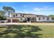 Beautiful two-story house with a three-car garage and lush lawn at 9050 San Martin Ne Blvd, St Petersburg, FL 33702