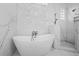 Modern freestanding bathtub with marble surround at 9050 San Martin Ne Blvd, St Petersburg, FL 33702