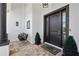 Inviting entryway with a porch swing and modern door at 9050 San Martin Ne Blvd, St Petersburg, FL 33702