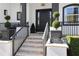Stylish entryway featuring a dark door and manicured landscaping at 9050 San Martin Ne Blvd, St Petersburg, FL 33702