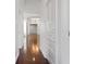 Bright hallway with hardwood floors and built-in storage at 9050 San Martin Ne Blvd, St Petersburg, FL 33702