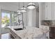 Luxury kitchen with marble countertops and high-end stainless steel appliances at 9050 San Martin Ne Blvd, St Petersburg, FL 33702