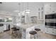 Modern kitchen with a large island, stainless steel appliances, and marble countertops at 9050 San Martin Ne Blvd, St Petersburg, FL 33702