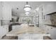 Large kitchen island with marble countertop and stainless steel sink at 9050 San Martin Ne Blvd, St Petersburg, FL 33702